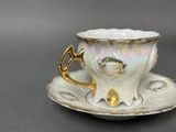 a cup and saucer on a saucer on a table