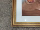 two framed pictures of flowers on the ground