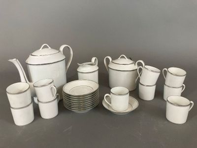 a lot of cups and saucers that are sitting on a table