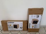 two boxes that are sitting on the floor next to each other