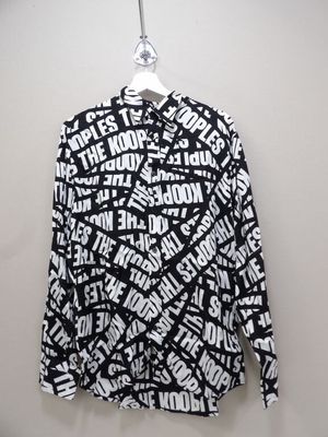 a black and white shirt with white words on it