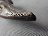 a close up of a bronze statue of a giraffe ' s head