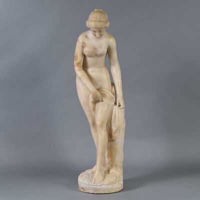 an image of a statue of a woman with a hat on her head