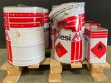 a stack of barrels sitting on a pallet next to a pallet