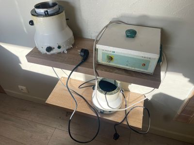 a small table with a blender and a toaster on it