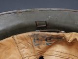 a close up of a baseball glove inside of a helmet