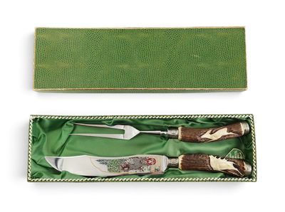 two knifes in a box with a green box on the side