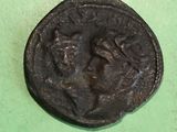 a close up of a coin on a green surface