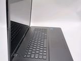 a laptop that is open on a white surface