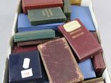 a box full of books sitting on top of a table