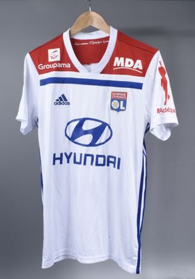 the shirt is white and blue with a red and white design