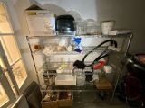 a metal shelving with a lot of food on it