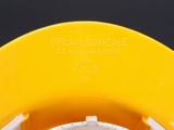 a close up of a yellow helmet with a black background