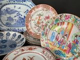 five plates with different designs on them on a table