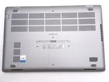 a laptop that is sitting on a white surface