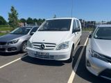 three cars parked in a parking lot next to each other
