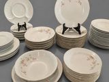 a lot of plates that are sitting on a table