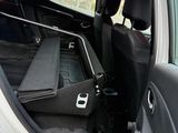 a seat in the back of a car with the door open