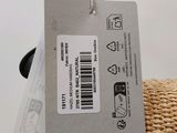 a label on the back of a basket that has a cell phone attached to it