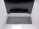 an open laptop computer sitting on top of a white table