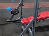 a red bench and a red bench in a gym