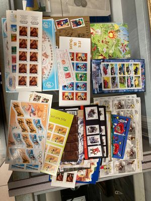 a display of stamps and postcards on display in a glass case