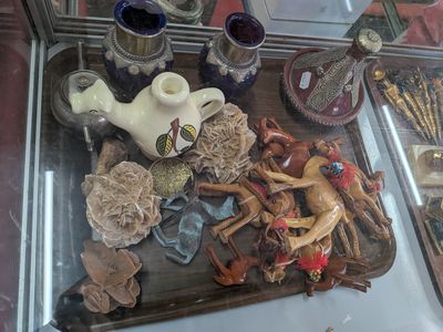a display case with a variety of figurines in it