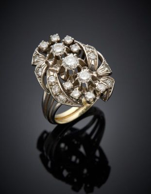 a gold and diamond ring, by business
