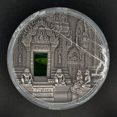 une image représentant une pièce d'argent sur laquelle figure l'effigie d'un temple