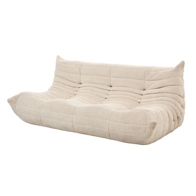 un canapé-futon blanc posé sur un sol blanc