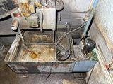 a dirty sink in the corner of the room