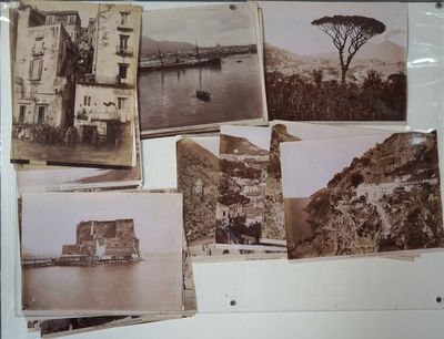 many old photos on the wall of a building