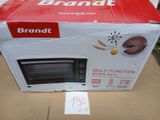 packaging of a brand new microwave oven sitting on top of a cardboard box