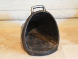 a small black pot sitting on top of a counter