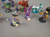 many figurines of different types and sizes on the table