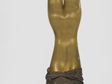 statue of a woman holding a flower in her right hand
