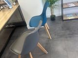 two chairs that are sitting in front of a desk