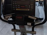 a treadmill with a laptop on top of it