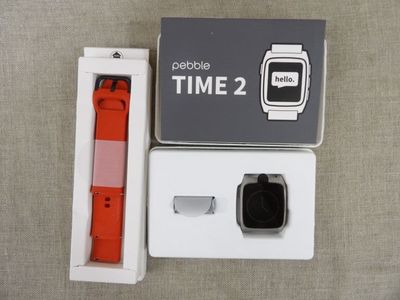 a box with a watch inside of it on a table