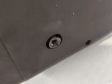 the back end of a laptop computer sitting on top of a table
