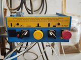 an image of a machine that is working on a piece of wood