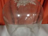 a clear glass jar with a lid on a table