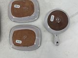 four different types of ice cream in plastic containers sitting on a table