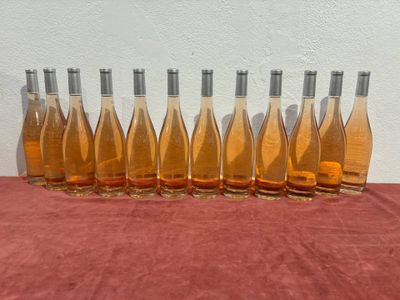 six bottles of wine are lined up on a table