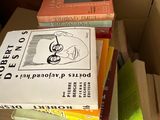 a box full of books sitting on top of a table