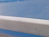 a close up of a car ' s door handle and the door handle of the car