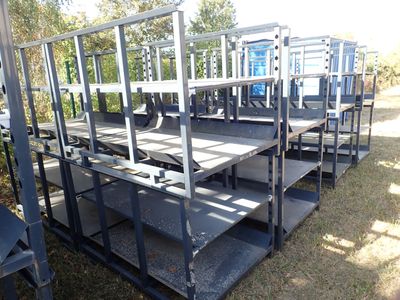 a lot of shelves that are sitting in the grass