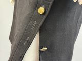 a close up of a jacket with buttons on a mannequin mannequin mannequin mannequin mannequin mannequin manne