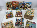 a bunch of comics are sitting on top of a table