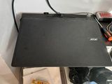a laptop computer sitting on top of a table